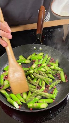 Pasta with green asparagus in tomato sauce