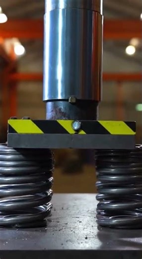 Steel springs vs hydraulic press ⚙️Watch the intense compression in slow motion. #shortsfeed