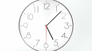 White wall  clock isolated on white background. Time lapse 1 hour.