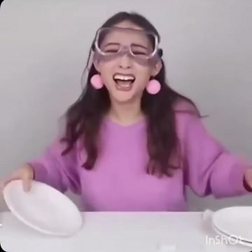 girl laughing and smashing plates