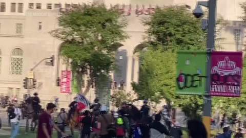 Officers on horseback in Los Angeles charge toward protesters