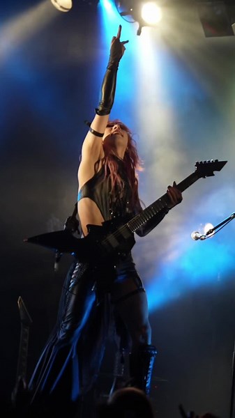 Female Guitarist Rocks Live Concert in Gothic Outfit