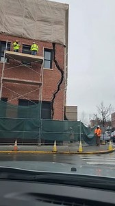 Building Facade Collapses During Work Bronx, New York — March 11, 2025 A dramatic video captured the moment the corner of a building under renovation suddenly collapsed onto a Bronx street Tuesday, sending workers scrambling and onlookers reeling in shock. The footage shows two workers on scaffolding as a foreman on the ground shouts, "Crack's running, back up! Everyone clear!" pointing to a massive fissure running down the building's brick facade. Seconds later, the entire corner of the buildin