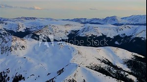 East Wall Chutes top of Arapahoe Basin Ski Resort chairlifts Colorado aerial drone Montezuma Loveland Pass winter spring golden hour sunset ski trail runs Rocky Mountains circle left parallax