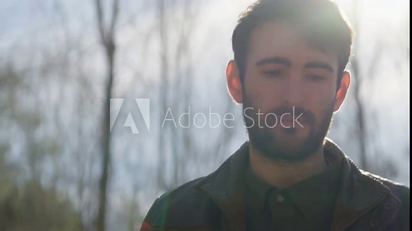 Man unloading bricks from a pickup truck and building an outdoor fire pit