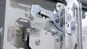 Slow motion: elevator door opening and closing mechanism at lift exhibition, trade show - close up view. Technology, engineering, machinery, equipment and electronic concept