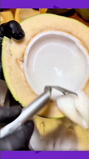 Scooping fresh young coconut meat for a healthy treat #coconut #healthyfood