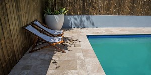 Dont use Travertine Pavers around the Pools