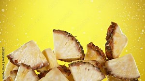Super slow motion of sliced pineapple with water splash flying in the air. Filmed on high speed cinema camera, 1000 fps.