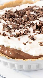 This fantastic Chocolate Pudding Pie has layers of whipped cream, simple homemade chocolate pudding in a pie crust, topped with chocolate curls. It’s every chocolate lover’s dream! To get more detailed instructions, helpful tips, or to print the recipe click below: https://www.errenskitchen.com/chocolate-pudding-pie/ | Erren's Kitchen | Facebook