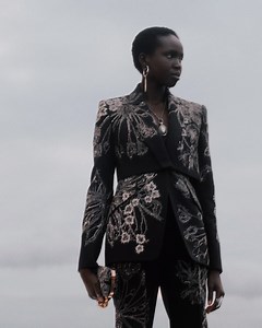 A trompe l’oeil overlay black wool silk jacket and peg trousers hand- embroidered with hammered silver bullion endangered flowers. From the Spring/Summer 2020 collection: on.AlexanderMcQueen.com/SS20Womens | Alexander McQueen