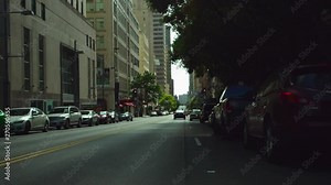 Steet view of urban downtown in city with people and cars.