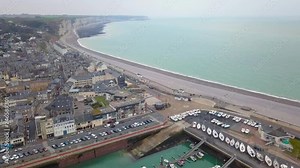 Aerial horizontal travelling video of the city and its marina and coastline in Fecamp Normandy France