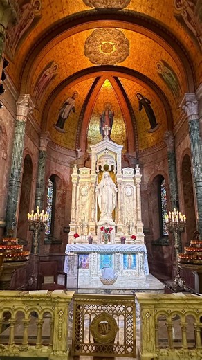 Shrine of Our Lady of the Miraculous Medal,features renowned,Carrara marble statue ofBlessed Mother.