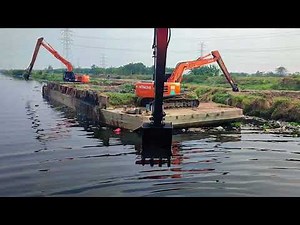 EXCAVATOR BARGE DREDGING