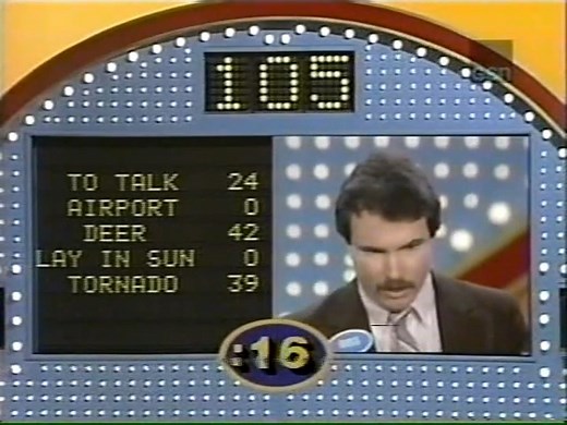 36 years ago, *Family Feud* returned with Ray Combs as the host, marking the show's first syndication revival! 🎤✨ After a successful daytime comeback on CBS earlier that year, the popular game show expanded to a daily syndicated version. 🏆 Four years into its run, the show introduced the "Bullseye" format, which compressed gameplay but ultimately couldn't stop declining ratings. 📉 Ray Combs hosted until 1994 when he was replaced by the original *Feud* host, Richard Dawson. Dawson's return, ho