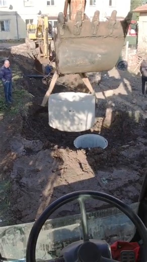 Digger planting manhole rings