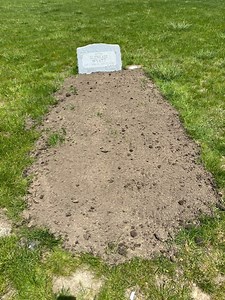 Headstone placed on wrong grave at Woodlawn Cemetery