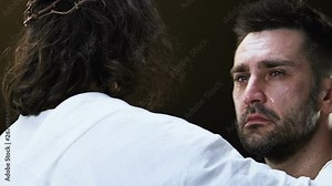 Christ hugging crying man, miserable sinner searching for forgiveness, close-up