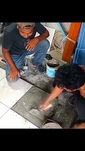 Andris teachs his helper the way to install floor tile #tileinstallation | Andris Brick Art