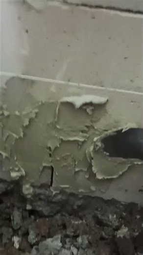 Before installing ceramic tiles on the hebel brick wall, a base cement layer is applied to it