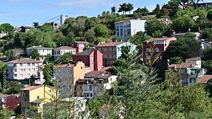 Istanbul Bosporus bridge view in the neighborhood of Usküdar with beautiful buildings in green scenery Stock Video