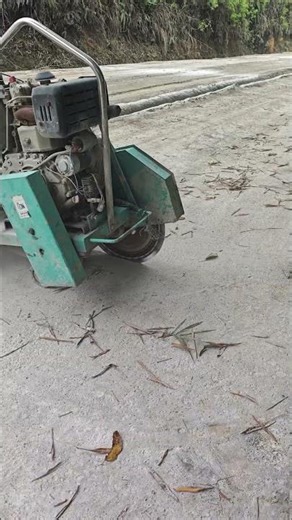 The process of cutting the pavement with a circular saw # construction