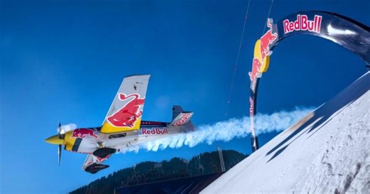 Daredevil pilot flies stunt plane down ski run in Austria