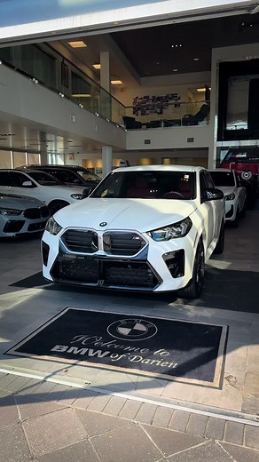 The all-new 2024 BMW X2 M35i in Alpine White. This SUV features a Red/Black Bicolor Perforated Veganza interior. Additionally, this X2 M35i is equipped with Driving Assistance Plus, Adaptive M Suspension, Illuminated Kidney Grille, M Sport Breaks with Blue Calipers, 20