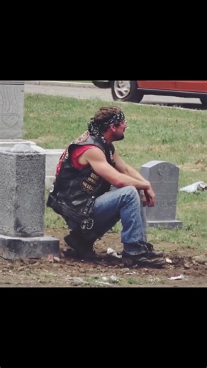 A biker showed up at my wife's grave every week and I had no idea who he was. For six months I watched him from my car. Same day. Same time. Every Saturday at 2 PM he'd roll up on his Harley, walk to Sarah's headstone, and sit there for exactly one hour. He never brought flowers. Never said a word that I could see. Just sat cross-legged on the ground next to her grave with his head bowed. The first time I saw him, I thought maybe he had the wrong grave. The cemetery's big. People get confused. B