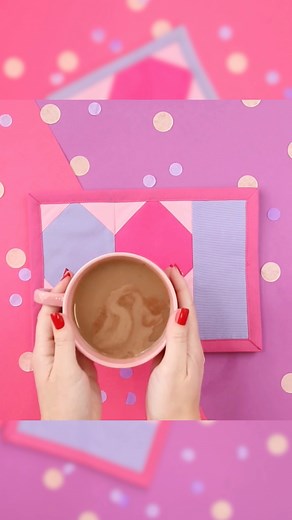 Create a cozy spot for your morning coffee or tea with plenty of room for a treat! ☕️ 🥐 This colorful Valentine's Heart Mug Rug can be easily made with this free foundation paper piecing sewing pattern. ❤️ Follow the tutorial here 👉 https://sweetredpoppy.com/valentines-heart-mug-rug-pattern/ | Sweet Red Poppy