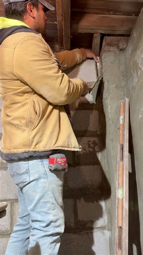 Installing a piece of block to fill the void in between the new and old foundation wall#work #job