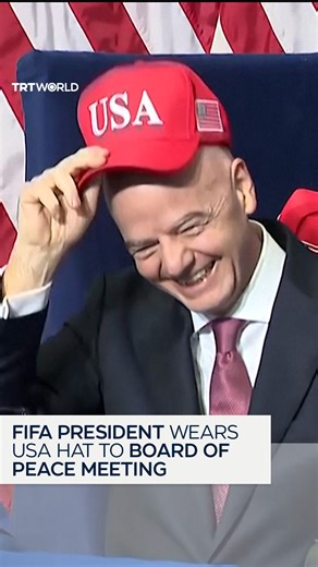 "Virtually everyone is the head of a country other than Gianni" FIFA President Gianni Infantino wears a red USA hat to the first meeting of the Board of Peace, where US President Donald Trump called attention to the fact that Infantino was the odd man out, before saying he liked the job of "head of soccer" the most. | TRT World