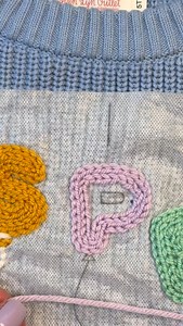 I find the genius of filling in yarn shapes also comes from how you “block” it. Now this is a term crotcheters and knitters use more often but I’ve inherited it for my embroidery. My method is to take a very damp garment so I like to run my gentle spin cycle in my washer or spray the embroidery section with a bunch of water. Think damp but not soaking wet. I’ll the manipulate the yarn to lay how I want it to lay, sometimes if it’s a really large shape like a hot air balloon or rocket ship I’ve d