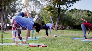 Senior sport people exercising during yoga workout class outdoor at park city. Fitness joyful Elderly lifestyle
