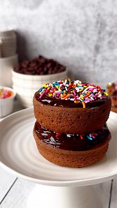 Hole in 🍩ne! Double Chocolate Ganache Sprinkled Donuts. Chocolate Donuts: * 1 3/4 cup all-purpose flour * 1 1/2 cup granulated sugar * 1/4 cup cocoa powder * 2 tsp baking powder * 1/4 tsp salt * 1 Lg egg * 1 1/4 cup whole milk * 2 tbsp unsalted butter, melted * 1 tsp pure vanilla extract Chocolate Ganache: * 1 cup chocolate chips * 1/2 cup heavy cream Optional, sprinkles of choice, we used rainbow Instructions: * Preheat oven to 350 degrees F. * Grease two 6 cavity donut pans. This recipe makes