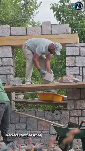 Building a Pink Stone Wall on Scaffold 🧱🪨 #stonemasonry #stonework #diy