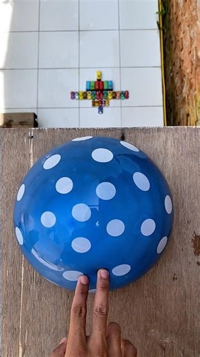 Experiment: Will this blue and pink polka dot water balloon explode if dropped from a height?