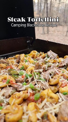 Hey Campers! Tonight’s camping dinner is steak tortellini with Buffalo Wild Wings Parmesan Garlic sauce—cooked up hot and fast on the Blackstone Products griddle right at the campsite. This easy, hearty, and ridiculously delicious meal is perfect for winding down after a long day outdoors. Camp cooking doesn’t get much better than this! #BlackstoneGriddle #blackstonecooking #CampingFood #CampfireCooking #EasyCampingMeals #RVLife #OutdoorCooking #CampingDinner #CampingMeals #griddlecrew Fire & Sm