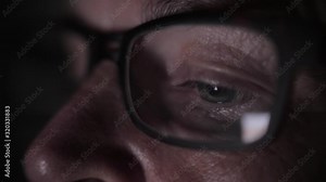 Older white woman with glasses scrolls through her phone (handheld)