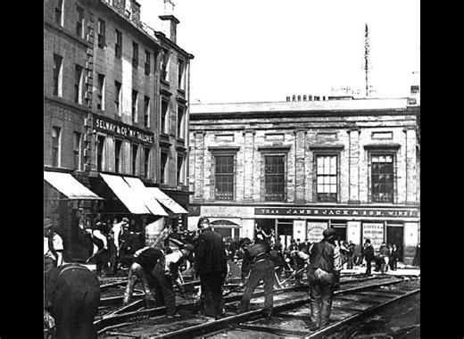 Echo of Paisley #19 – The Trams at the Cross This weeks echo captures workers laying tram tracks at Paisley Cross in 1903. The first electric trams began running the following year, connecting Paisley with Barrhead, Elderslie and Renfrew. The network was later absorbed into Glasgow Corporation Tramways, but trams remained a familiar sight in the town until the very last one ran on 11 May 1957. Do you or your family have memories of Paisley’s tram days? #EchoOfPaisley #PaisleyHistory #PaisleyTram