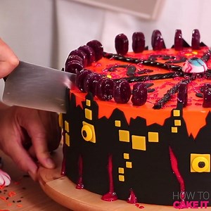 These cakes spin our heads right 'round! Who said you can't play with your food? These cakes were MADE to be played. Made with BOTH chocolate and vanilla cake, this Halloween Roulette cake is decked out in spine-chilling fondant, filled with the most DISGUSTING treats, and decorated with bloody gummy eyes that have their gaze locked on you! Sardines, anyone?? | How To Cake It