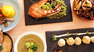 Various dishes of traditional Norwegian cuisine served with vegetables and herbs