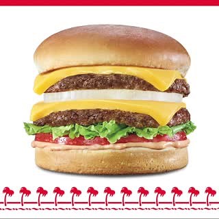 The Double-Double®. Made with two 100% beef patties, two slices of American cheese, hand-leafed lettuce, vine ripened tomato, and our classic spread all stacked high on a freshly baked bun. | In-N-Out Burger