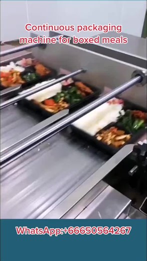Continuous packaging machine for boxed meals