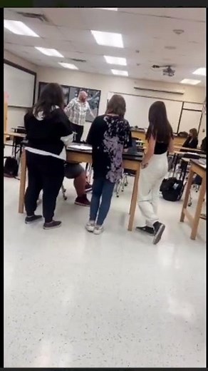 Teacher gets mad and throws desk