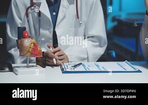 close - up of doctor hand holding clipboard in clinic