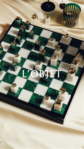 A celebration of form, function, and rarity, the Malachite Chess Set is a refined interpretation of the classic game. Each square is meticulously inlaid with real malachite and marble, revealing the stone’s singular beauty. Resting on a lacquered wood base, it becomes a collector’s piece, where strategy is transformed into art. #lobjet #LOBJETHoliday | L'Objet