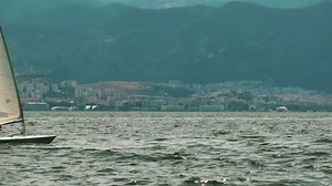 Small sailboat sailing the sea - Free Stock Video