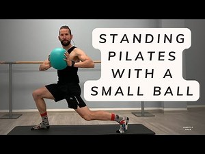 standing pilates with a small ball
